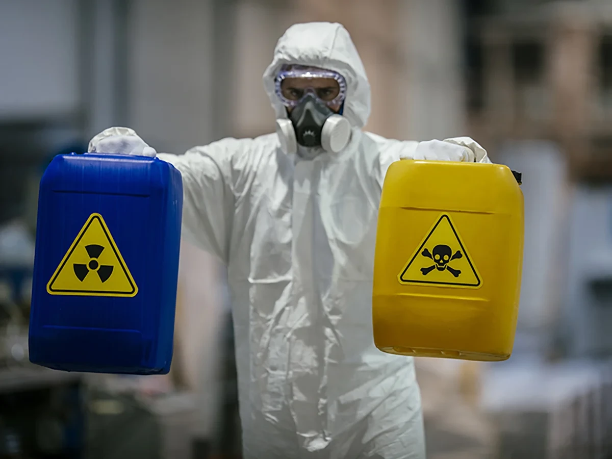 Biohazard cleanup technicians in protective equipment at a remediation scene in Stevens Point, WI